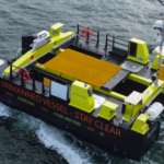 Uncrewed surface vessel - yellow - on water