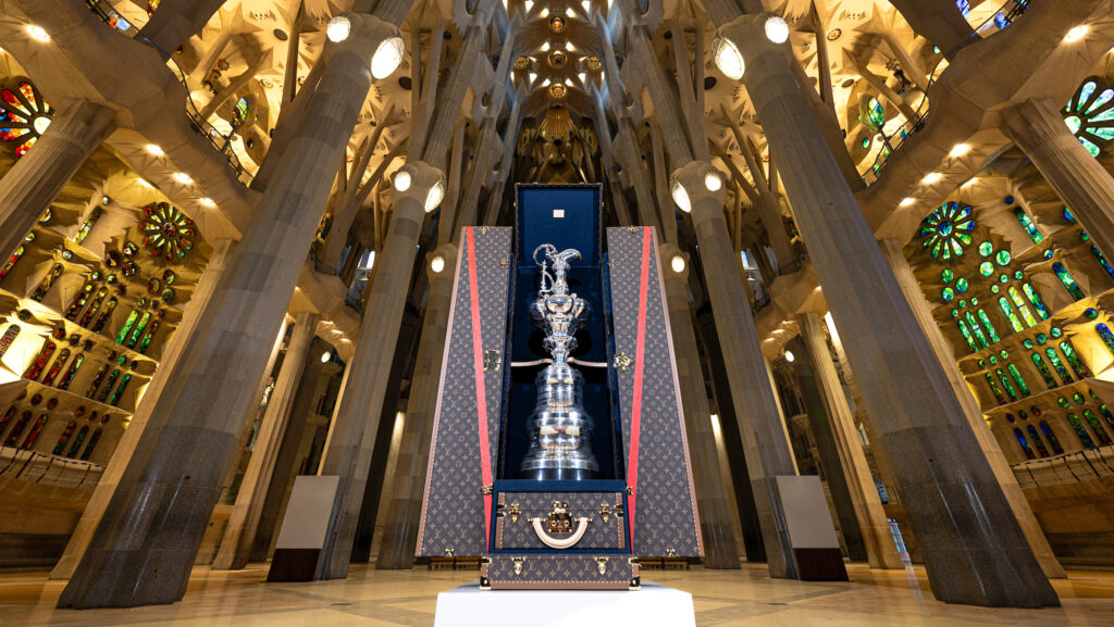 October 18, 2024. Louis Vuitton 37th America's Cup, America's Cup Tropy at Sagrada Familia. The Sagrada Familia, with its towering spires and intricate design, reflects Antoni Gaudí’s genius. Located in the heart of Barcelona, it has been under construction since 1882. Each façade holds deep symbolic meaning. It is a pilgrimage site for both art lovers and the faithful. The basilica is considered a masterpiece of modernism and one of the most visited monuments in the world, reflecting Gaudí’s unparalleled vision. The completion of the Tower of Jesus (172,5m high) is currently underway, with plans to inaugurate it in 2026, which will transform Barcelona’s skyline.