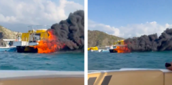 Catamaran boat on fire in Colombia. flames and smoke billow into air as tourists abandon ship and jump into water