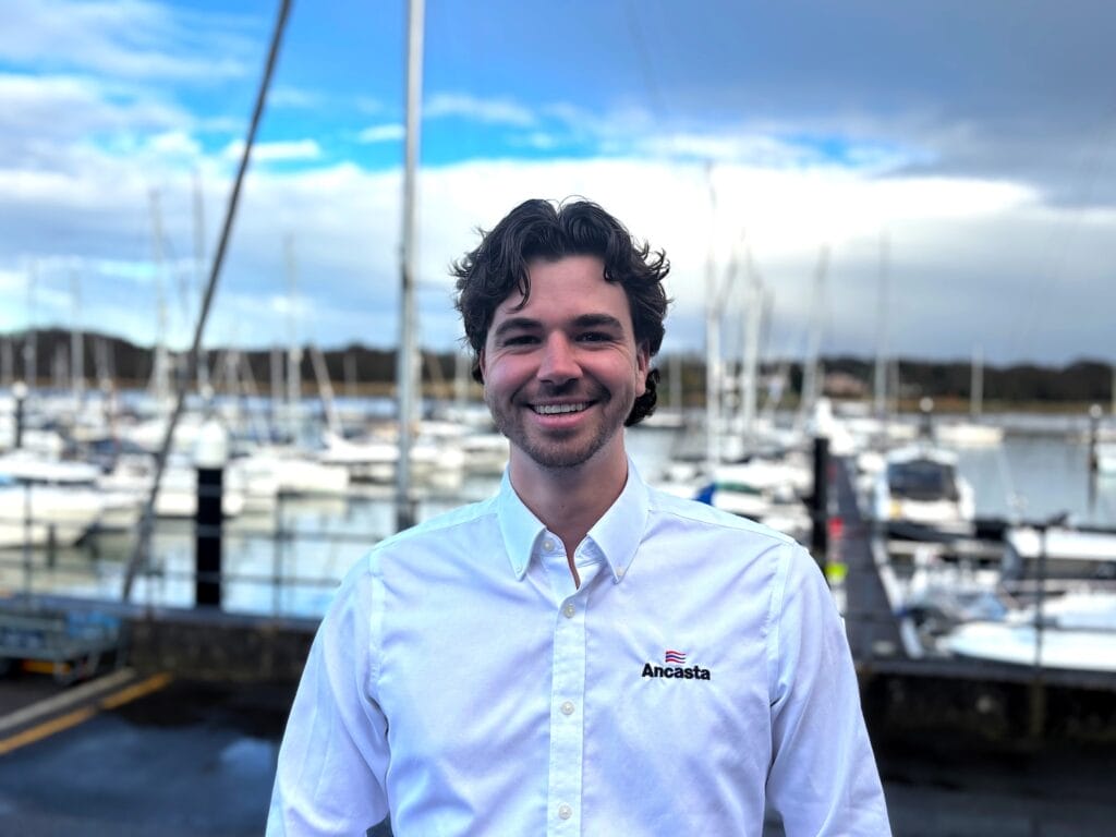 Oliver Windsor in white shirt looks at camera - he works for Ancasta