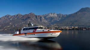 Italian coastguard vessel speeds through the water