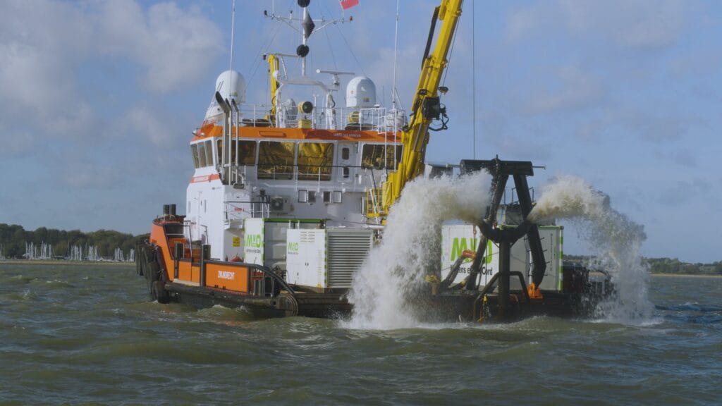 Harwich Haven Authority introduced Tiamat which is seen on back of workboat as it clears navigable mud