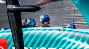 Peter Burling sits in ETNZ America's Cup boat along with crew members