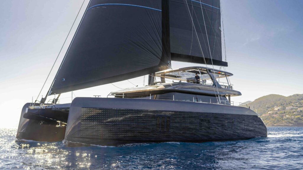 Large black catamaran with solar panel superstructure