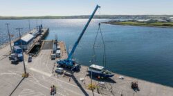 Electric hydrofoil 20ft boat on harbour wall in Orkney