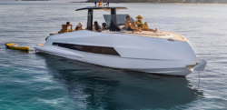 Astondoa 377 Coupe - wjhite boat - pulls a dinghy and is packed with people having fun