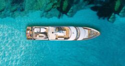 Aerial image of a superyacht on bright blue water to illustrate the environmental credentials of HVO fuel for superyachts (ref BFuture)