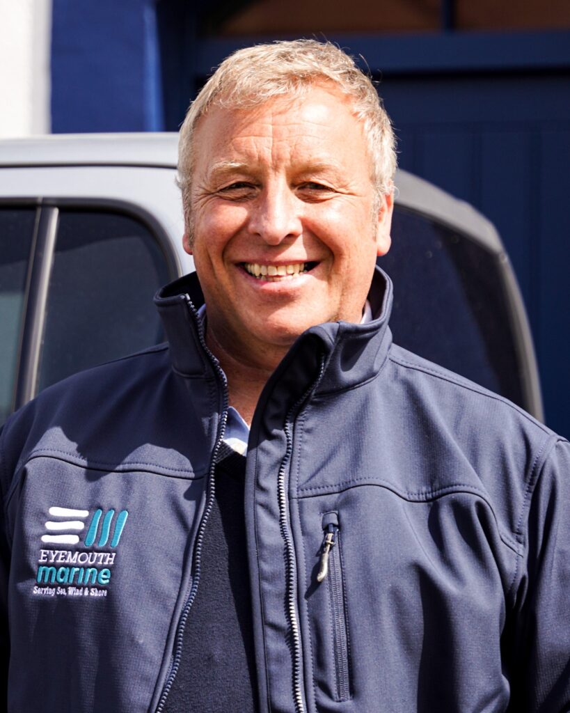 man smiles at camera. It's Eyemouth Marine's MD, Neil Harrison