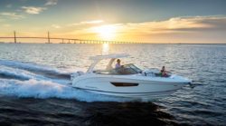 Boat with sunset in background used to illustrate OneWater Marine's website and financial results