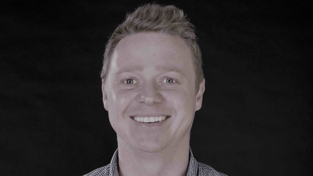 Black and white headshot of business man