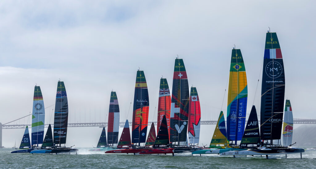 France SailGP Team helmed by Quentin Delapierre and Mubadala Brazil SailGP Team helmed by Martine Grael lead the rest of the SailGP fleet as they pass the Golden Gate Bridge on Race Day 2 of the Oracle San Francisco Sail Grand Prix held in San Francisco, California, USA. Sunday 23 March 2025. Rolex SailGP Championship Event 5 Season 2025. Photo: Felix Diemer for SailGP. Handout image supplied by SailGP