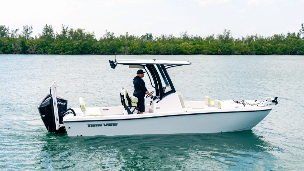 Side view of white boat. It has a canopy and is sized for inshore exploration. Made by TwinVee - used to illustrate TwinVee results announcement