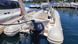 Aqua superPower charging an electric boat on Lake Geneva. View of stern of RIB with electric plugged in