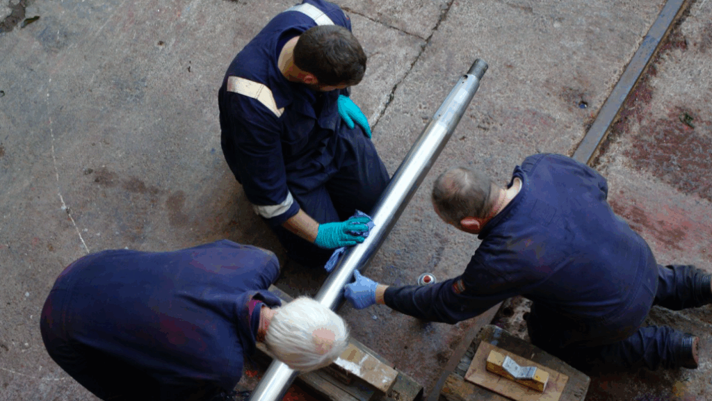 aerial picture of three workers at Eyemouth Marine