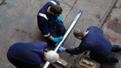 aerial picture of three workers at Eyemouth Marine