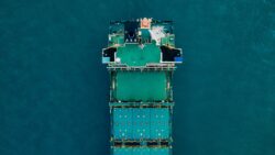 green cargo ship from above