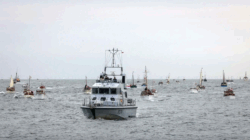Navy craft in foreground, Dunkirk Little Ships following along