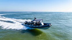Utilitarian RIB driving fast across the water