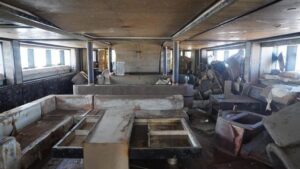 Gloomy interior of Bayesian superyacht recovered from ocean