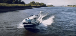 Boat races along river with Hertz Marine Audio speakers blasting its soundtrack