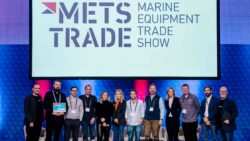 Businessmen and women on stage at Metstrade