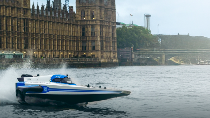 E1 boat seen on Thames in front of Houses of Parliament