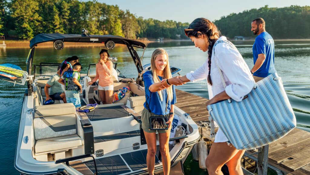 Family boards boat from pontoon