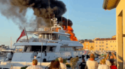 Superyacht burns - flames rip into sky as tourists look on in St Tropez