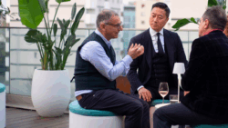 three men sit drinking wine on Nauty's furniture range from Gallinea