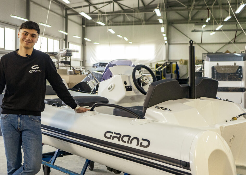 Nick Belousov from Grand Boats stands by vessel in factory in Ukraine