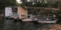 Tourist boast along a river in Victoria Falls Zimbabwe - showing use of outboard engines