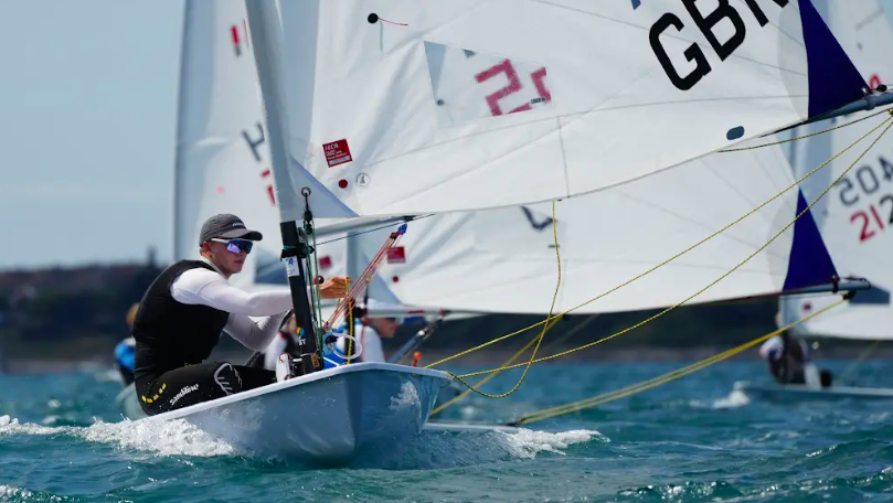 ILCA races with male sailor onboard