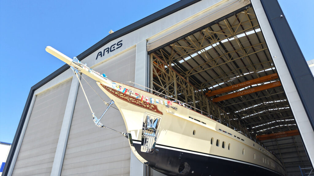 Sailing ketch superyacht Simena's bow coming out of factory