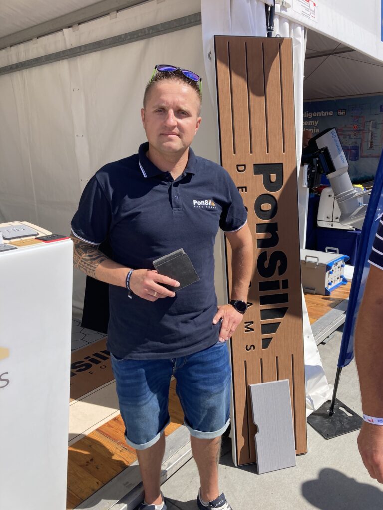 Sebastian Pasierowski PonSil stands outside booth at Polboat