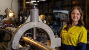 Apprentice girl in boatbuilding factory