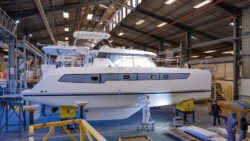 Large leopard catamaran under construction in boat shed
