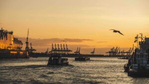 commercial harbour with yellow sunrise
