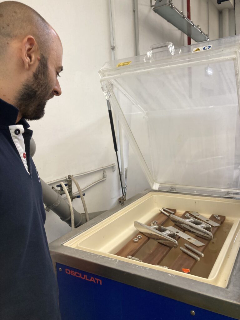 Employee at Osculati looks into product testing machine