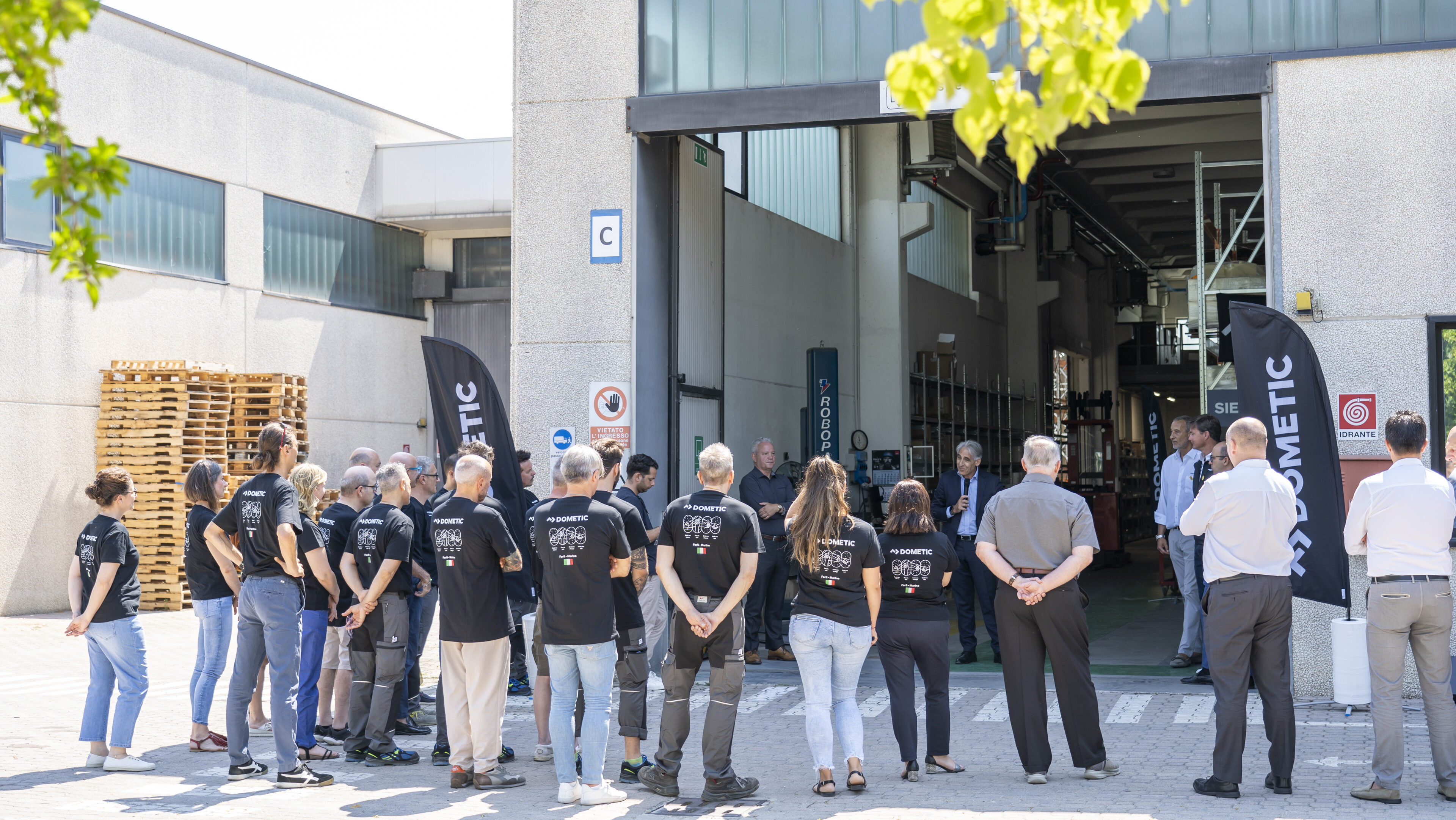People standing outside Dometic building