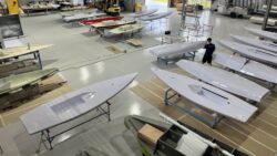 ILCA being made in Performance Marine Group premises Australia - hulls arranged in room