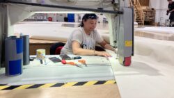 craftsman at Sale Service sews sail