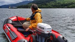 image of man in dingy with selva outboard engine