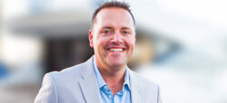 businessman smiling in light suit