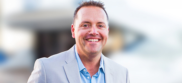businessman smiling in light suit
