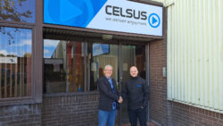 Two men shaking hands in front of Celsus UK office