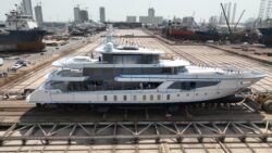 side view image of white 3-deck superyacht - Romeo 55