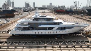 side view image of white 3-deck superyacht - Romeo 55