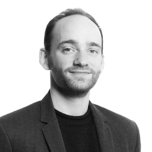 black and white business shot of a man smiling
