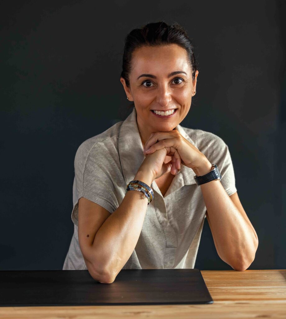 Fiorella Besenzoni, Besenzoni marketing manager, sits in a chair and considers the benefits of the demand for bigger boats and what that means to her company
