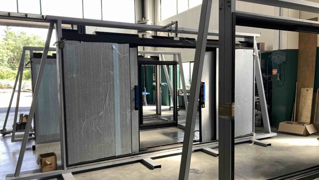 Glass sliding doors under construction at factory